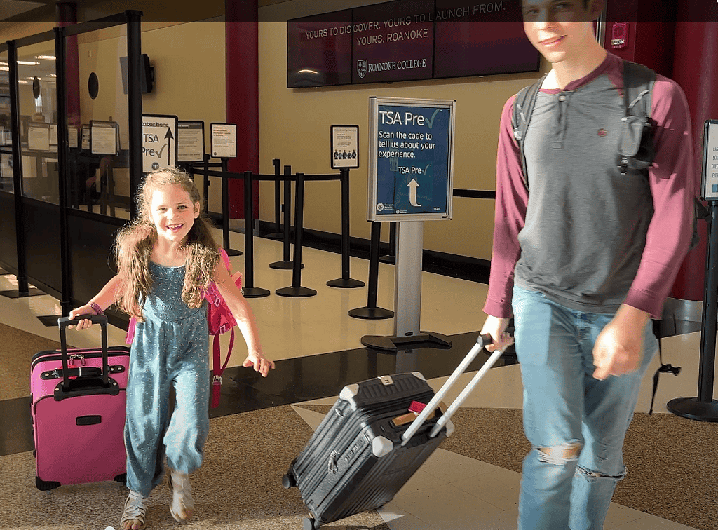 brother and sister get off the airplane