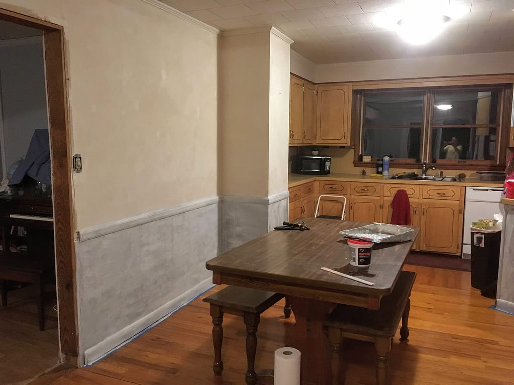 dining room wood paneling being primed