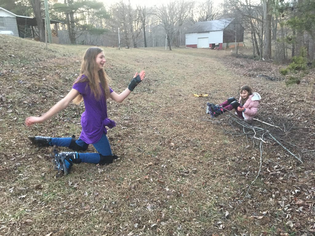 two girls playing outside
