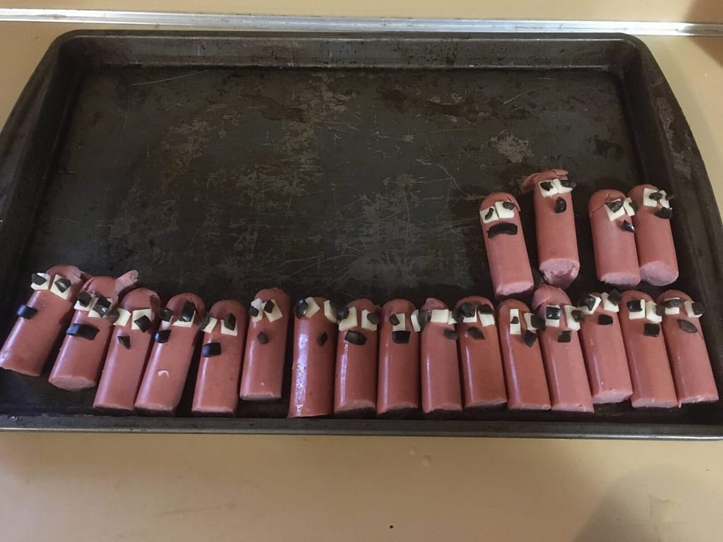 groundhog hotdogs on a cookie sheet