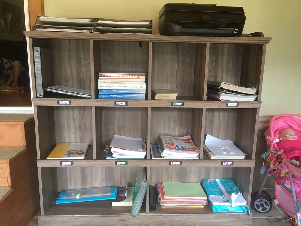 cubbies with homeschool books and supplies in a homeschool classroom