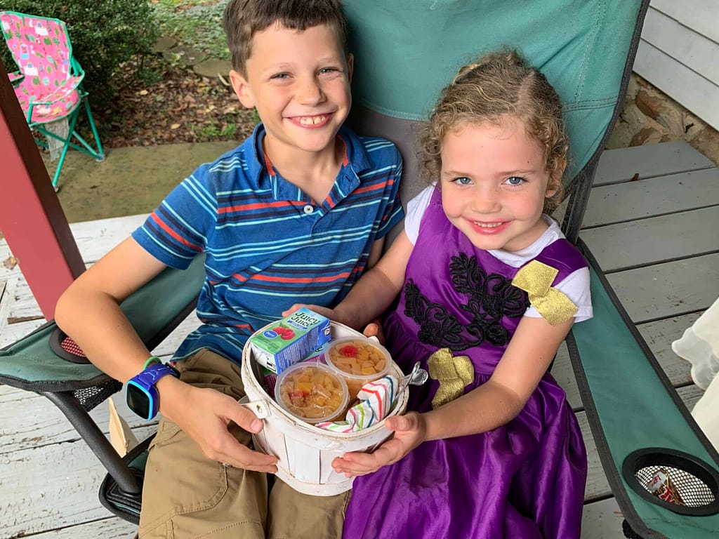 boy and girl share a picnic lunch