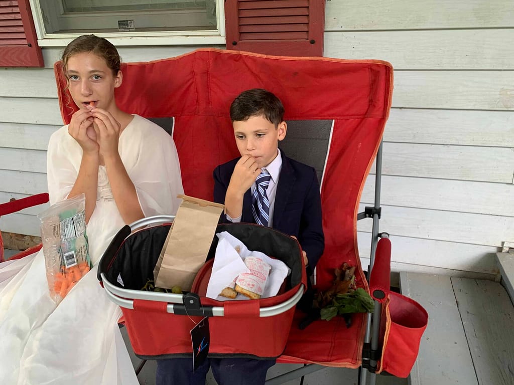 boy and girl share a picnic lunch
