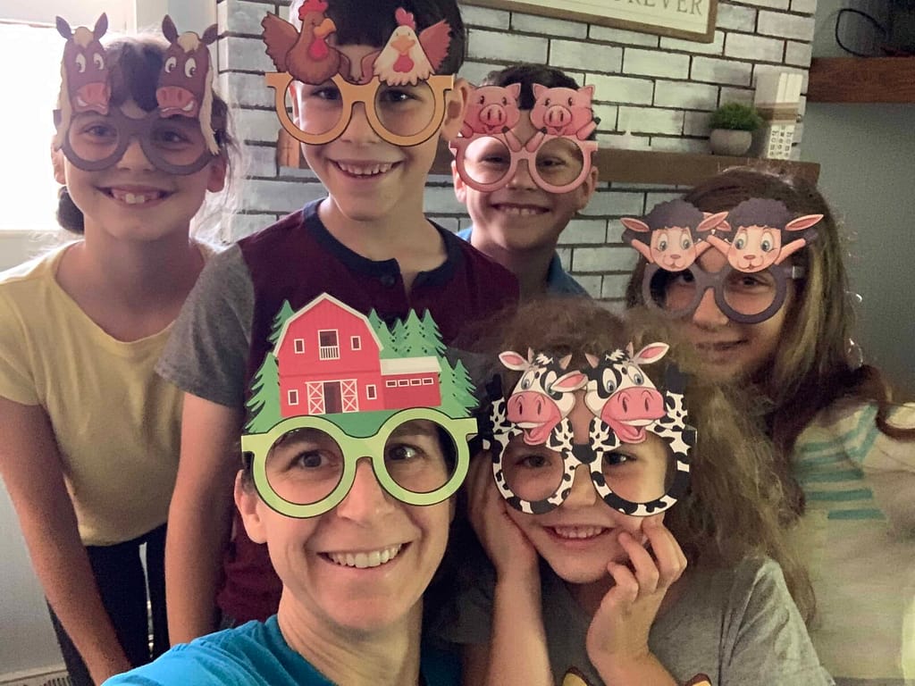 kids and mom wearing farm themed glasses