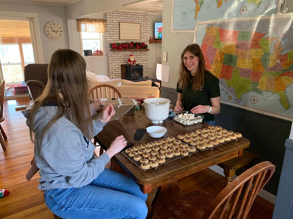 2 girls making cookies