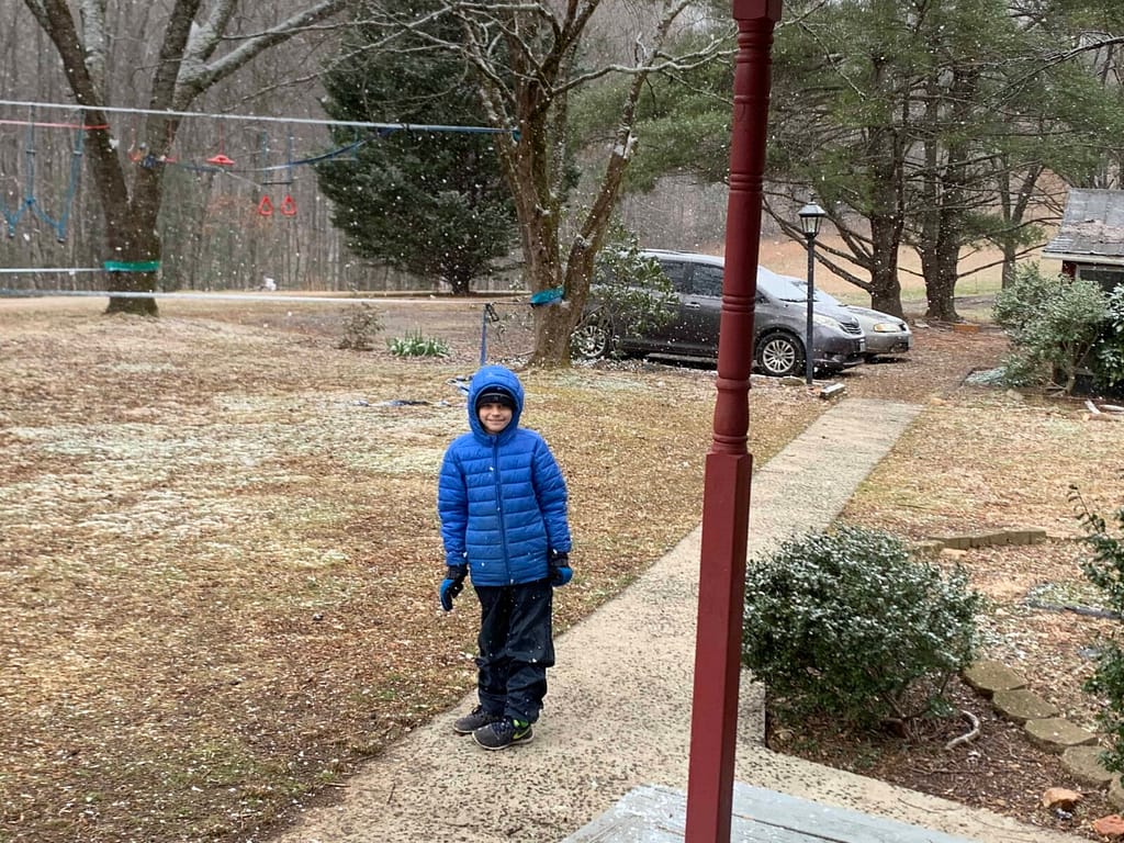 10 year old playing as it starts to snow