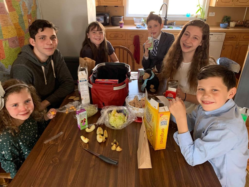kids sitting at the table doing a calpurnia tate luncheon