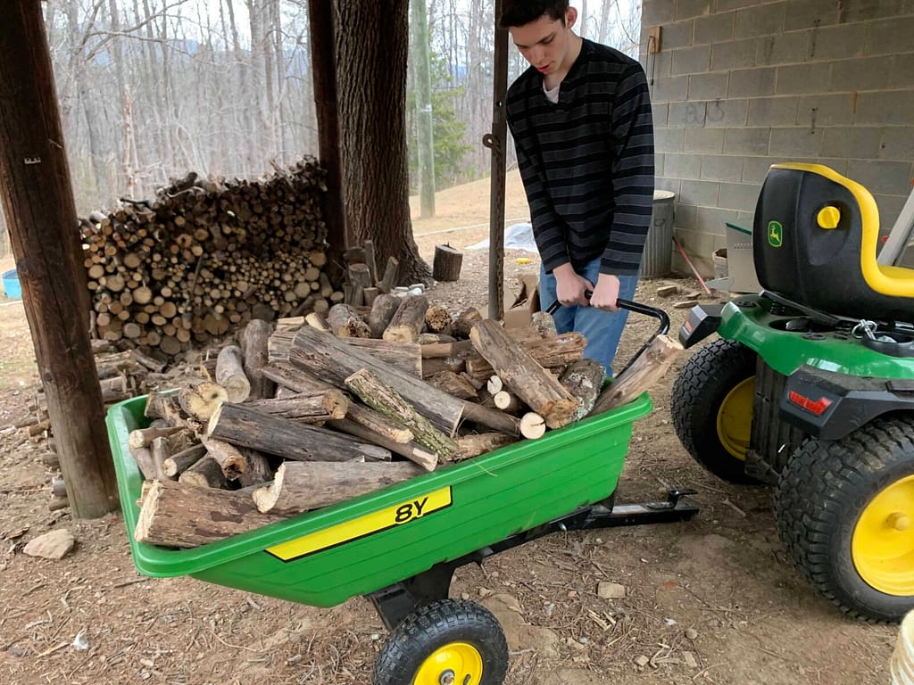 John Deere wagon full of wood