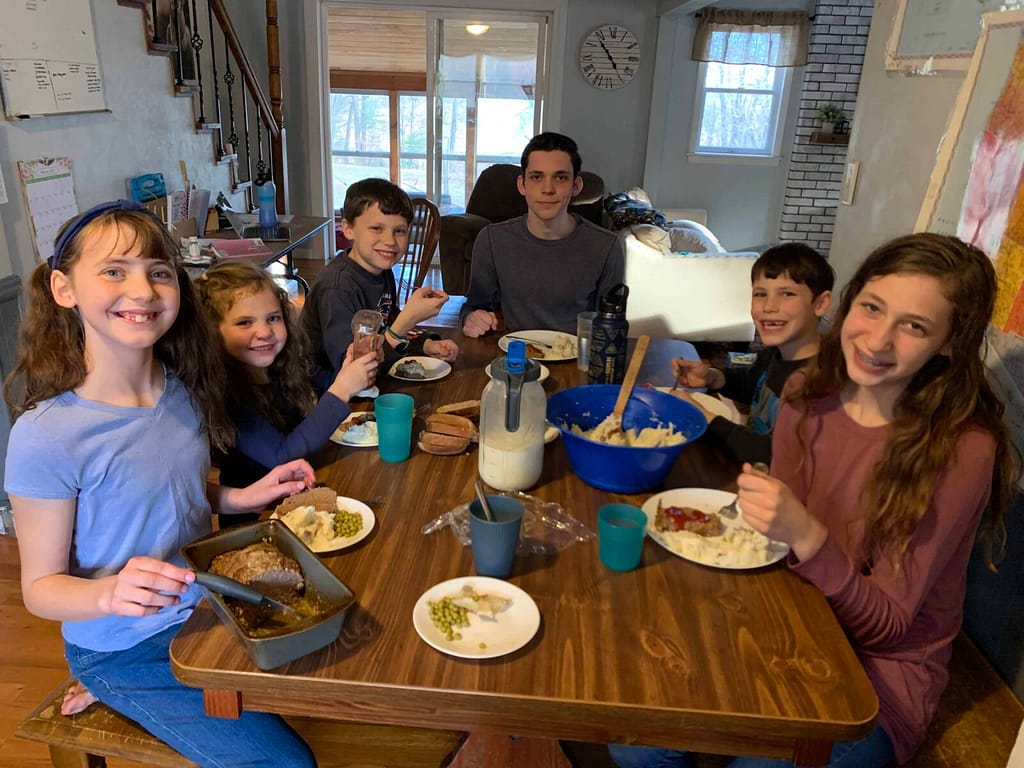 family eating meat loaf around the table