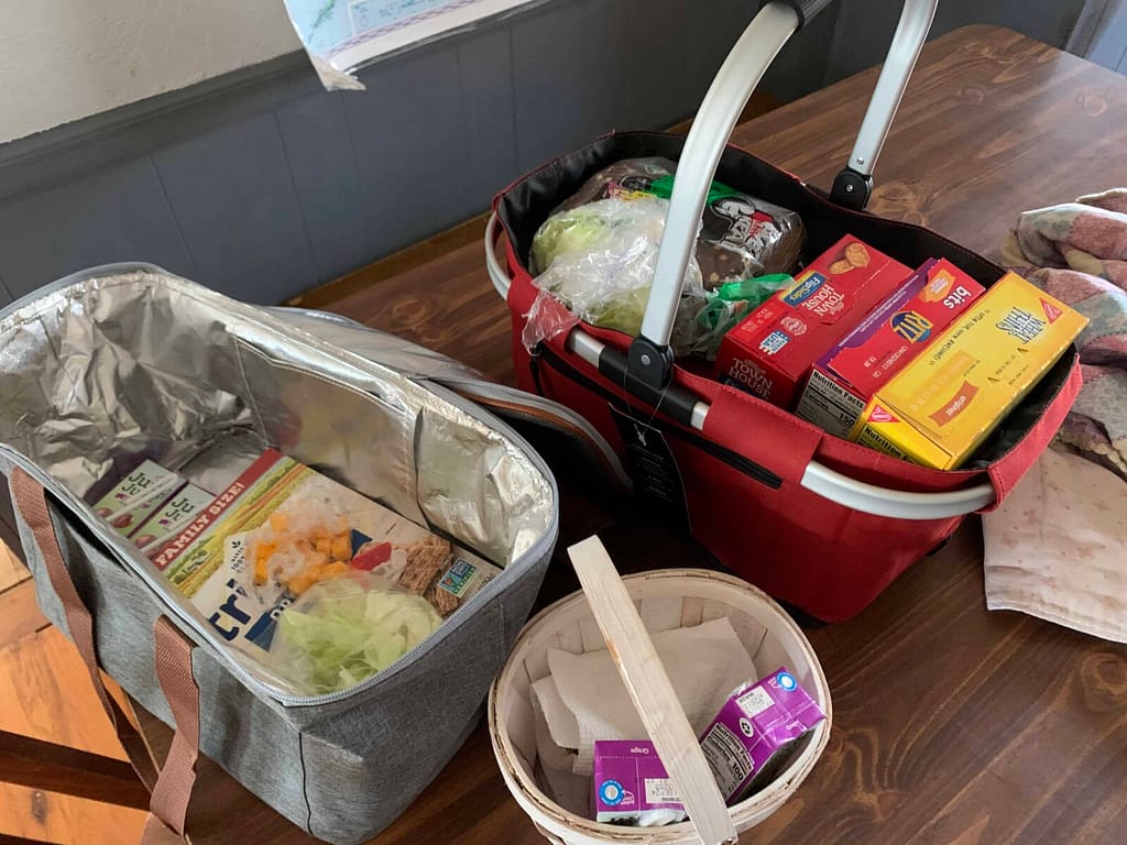 3 picnic baskets full of food for lunch