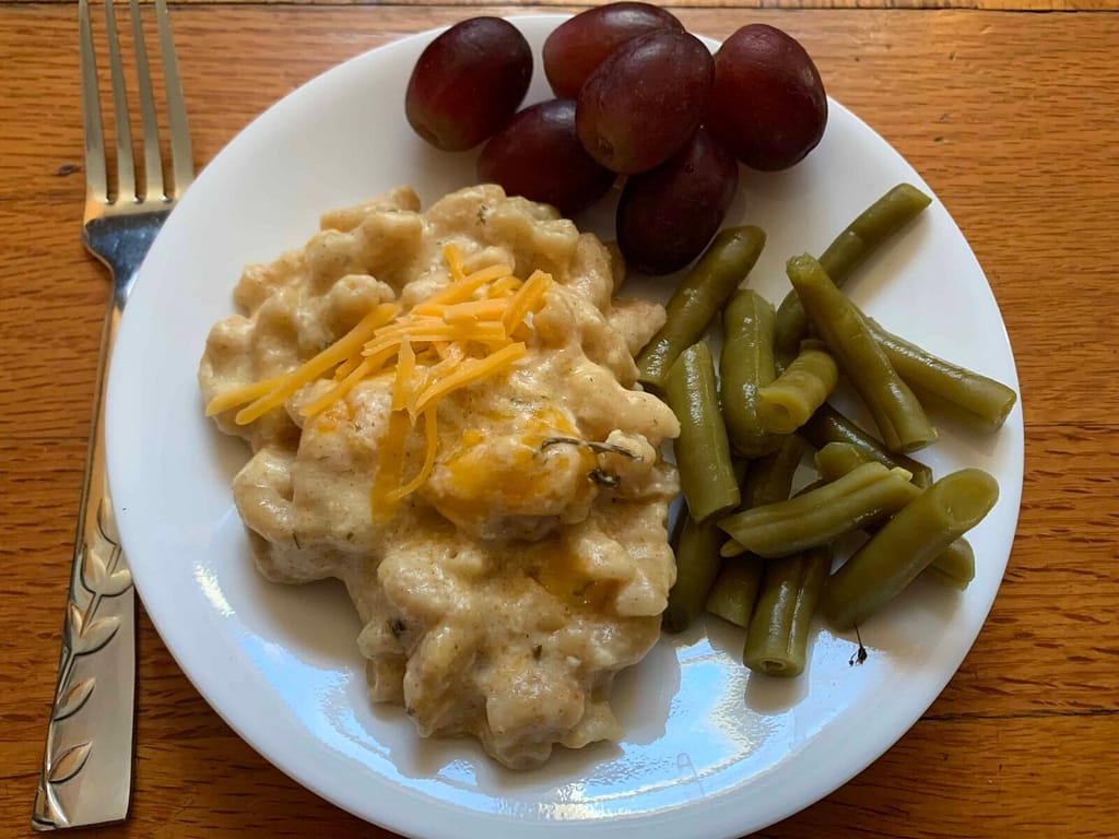 plate with crock pot macaroni and cheese on it