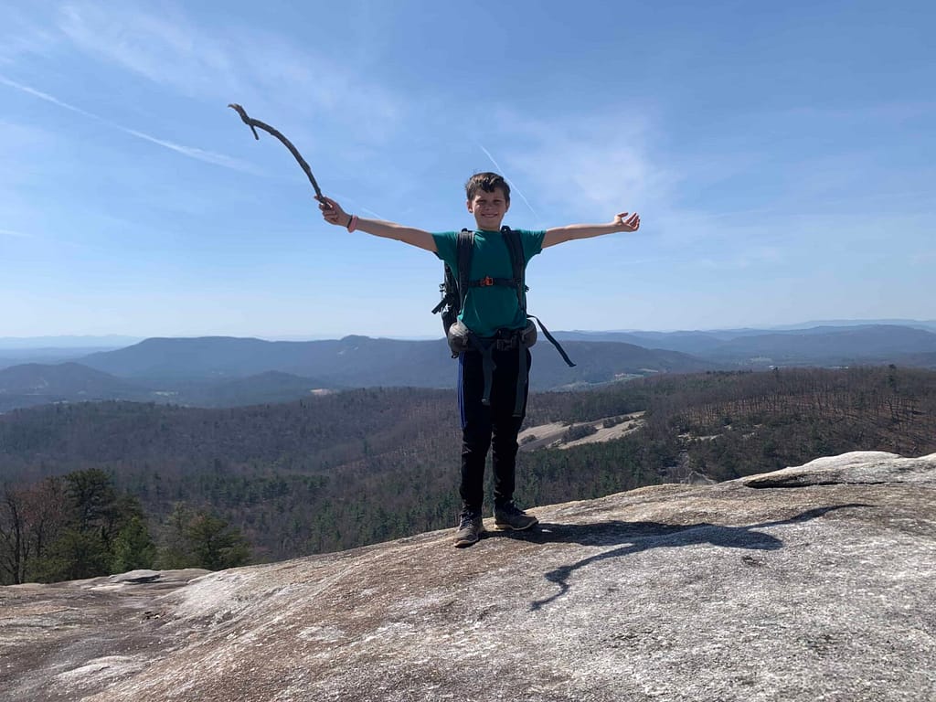10 year old boy on top of stone mountain, NC