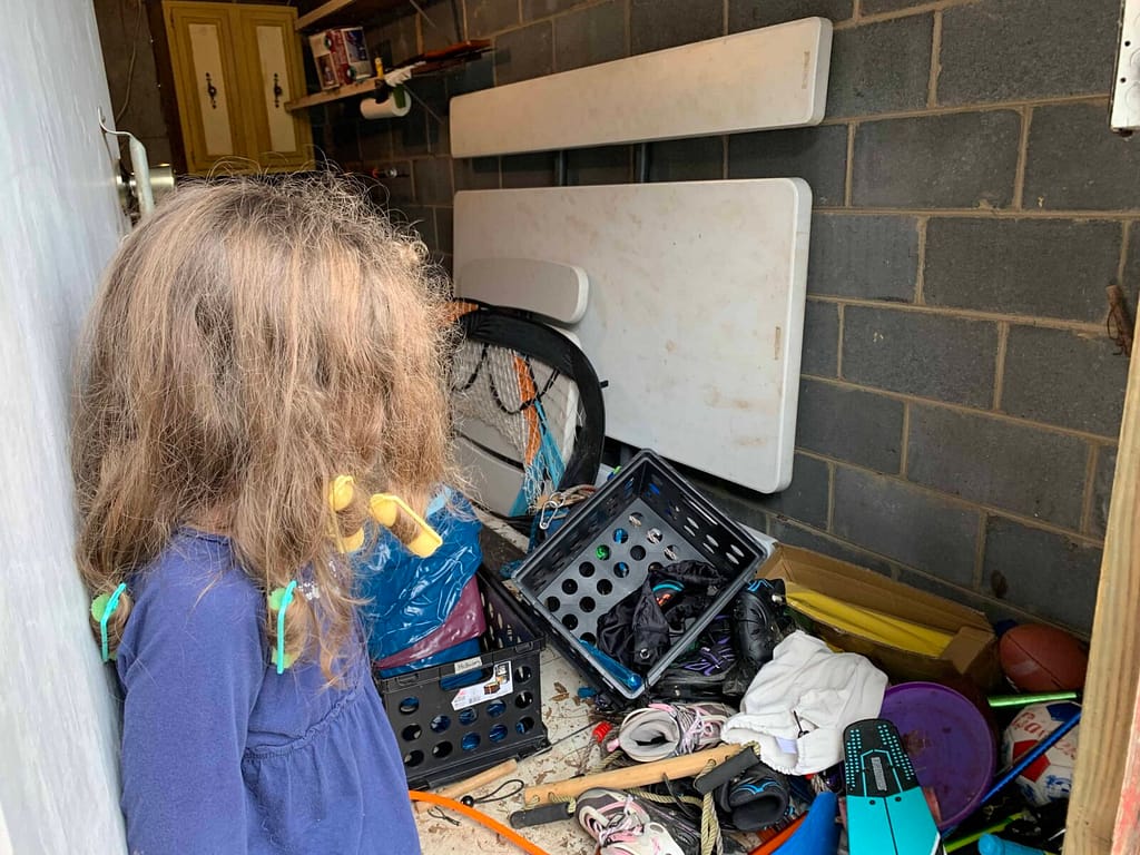inside a messy bike shed