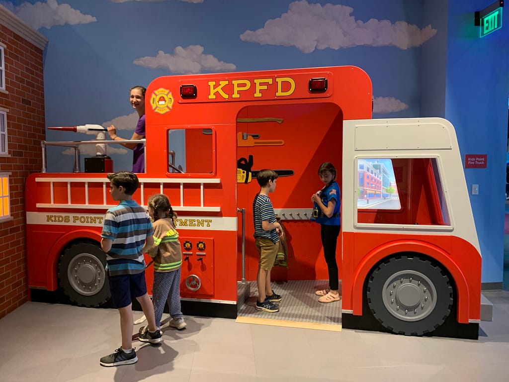 fire truck in a museum for kids to play on