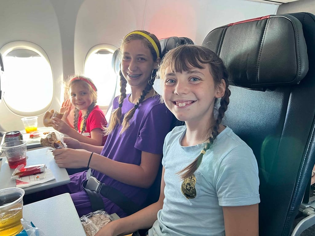 3 sisters on an airplane