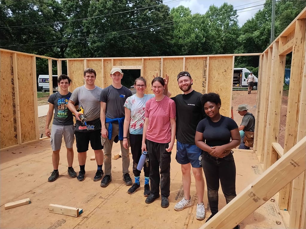 youth helping with a habitat for humanity build
