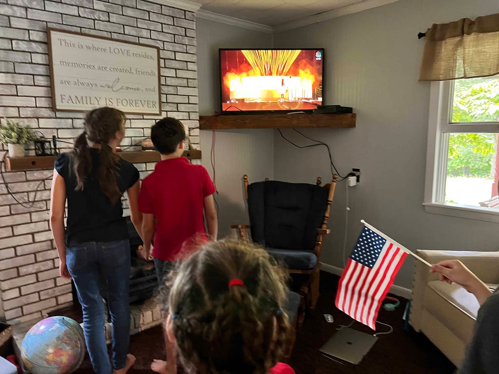 kids pretending to light olympic torch