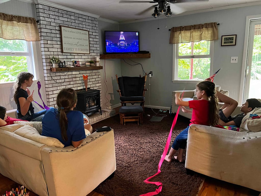 family watching Olympics on tv