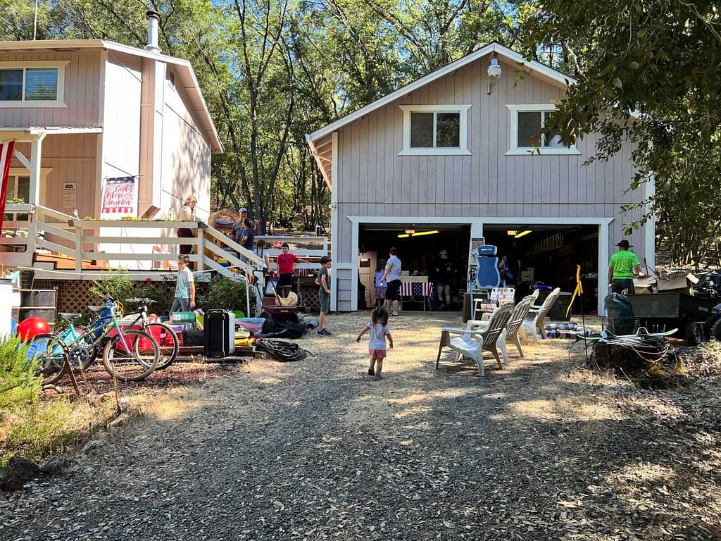 yard sale in front of a big country house