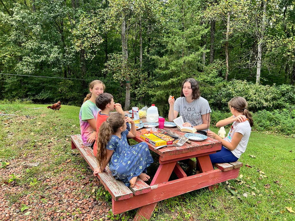 kids eating at a picnic table