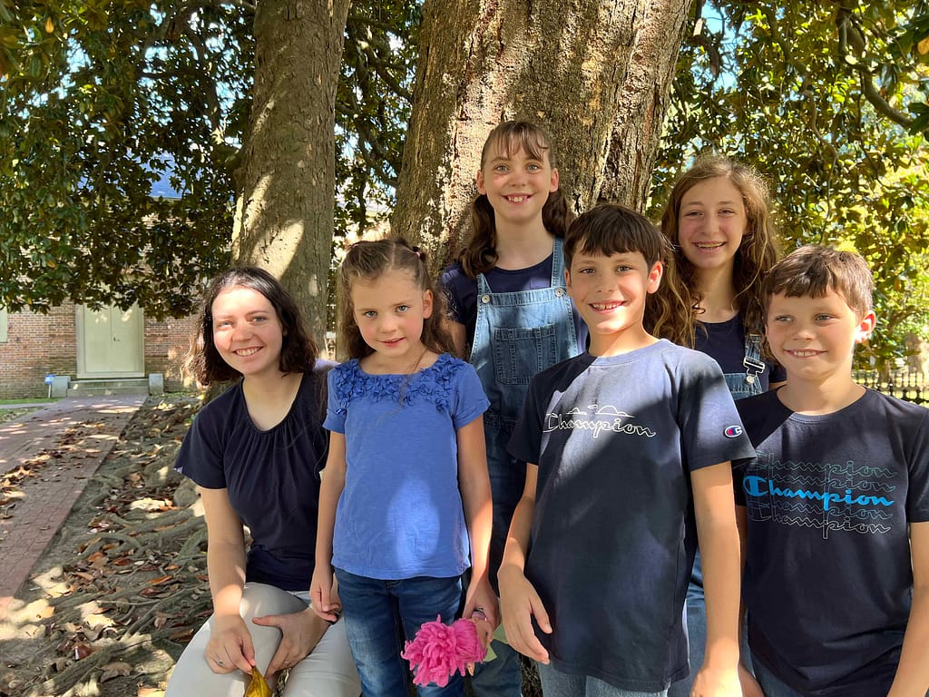 siblings at magnolia tree in Edenton, NC