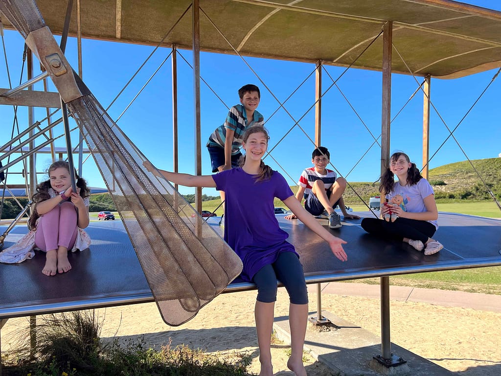kids playing on Wright flyer
