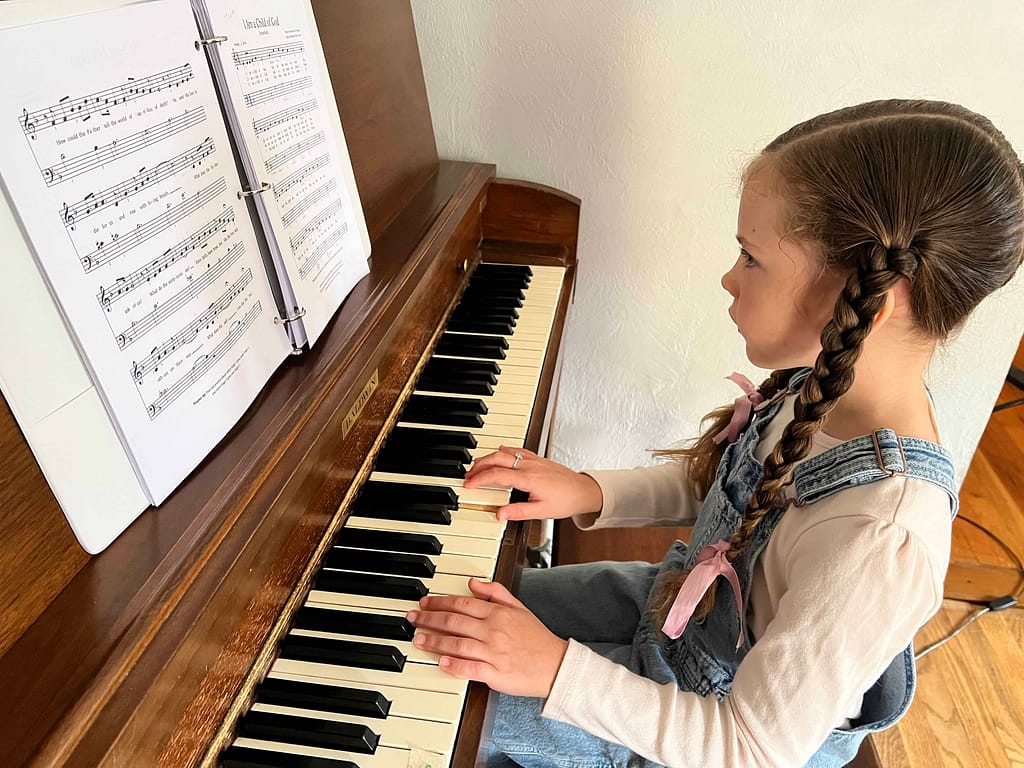 7 year old girl playing the piano