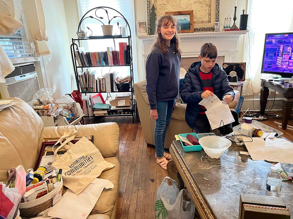 kids cleaning a messy living room