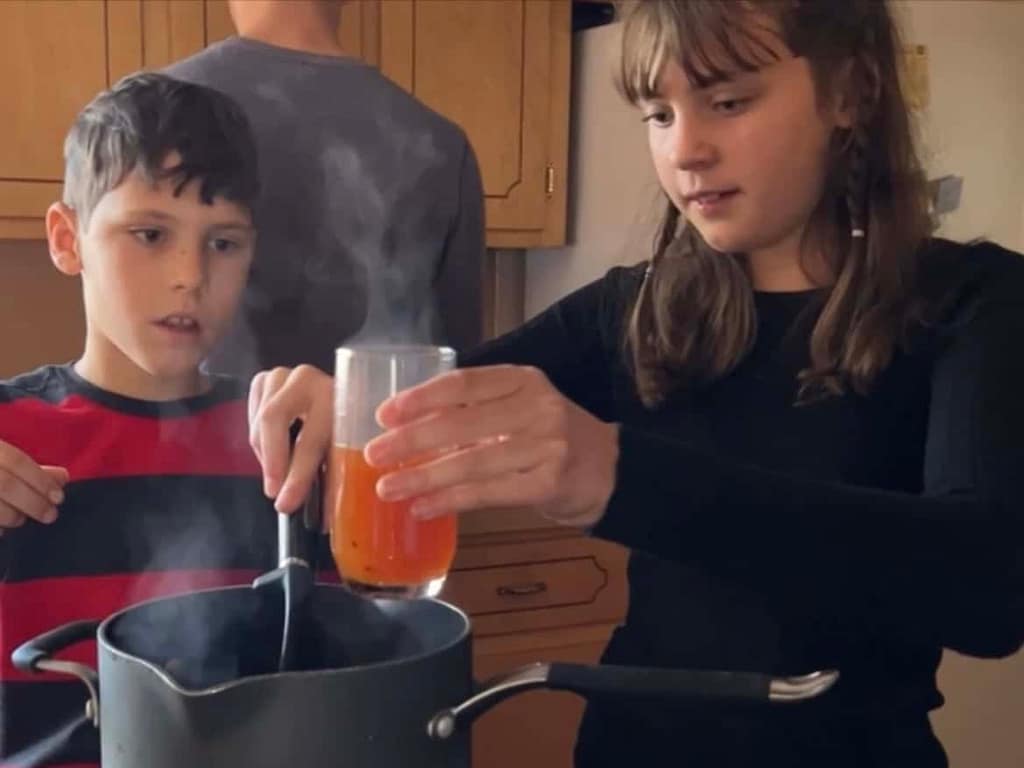 kids serving up apple cider