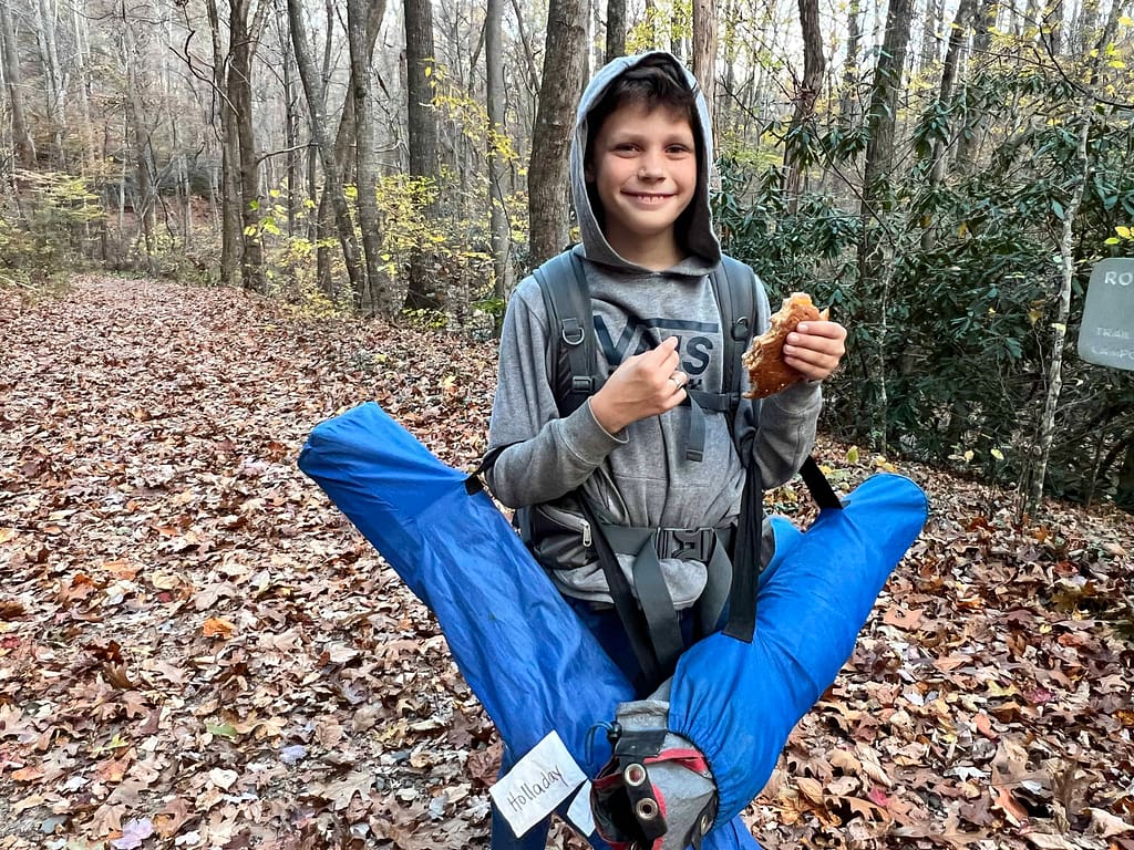 11 year old hiking with camp gear