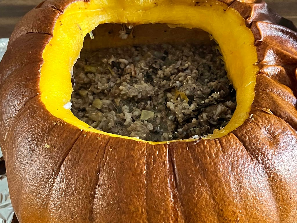 meat mixture in a cooked pumpkin