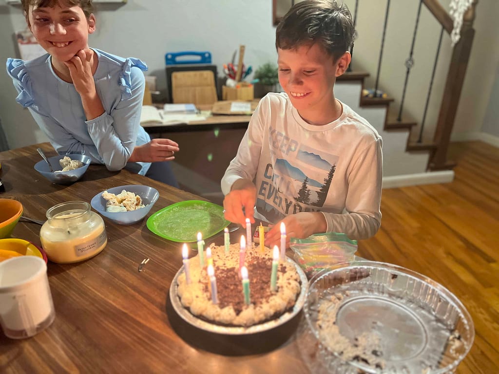 boy turning 11 and blowing out candles