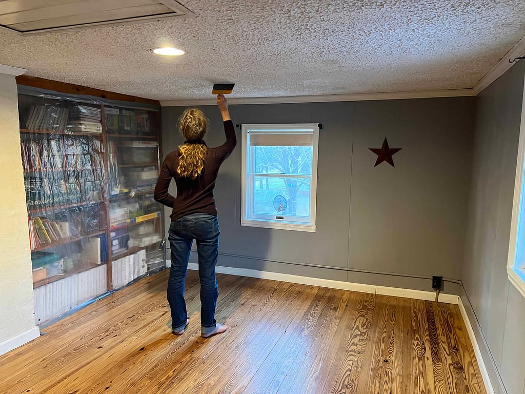 14 year old girl scraping popcorn ceiling