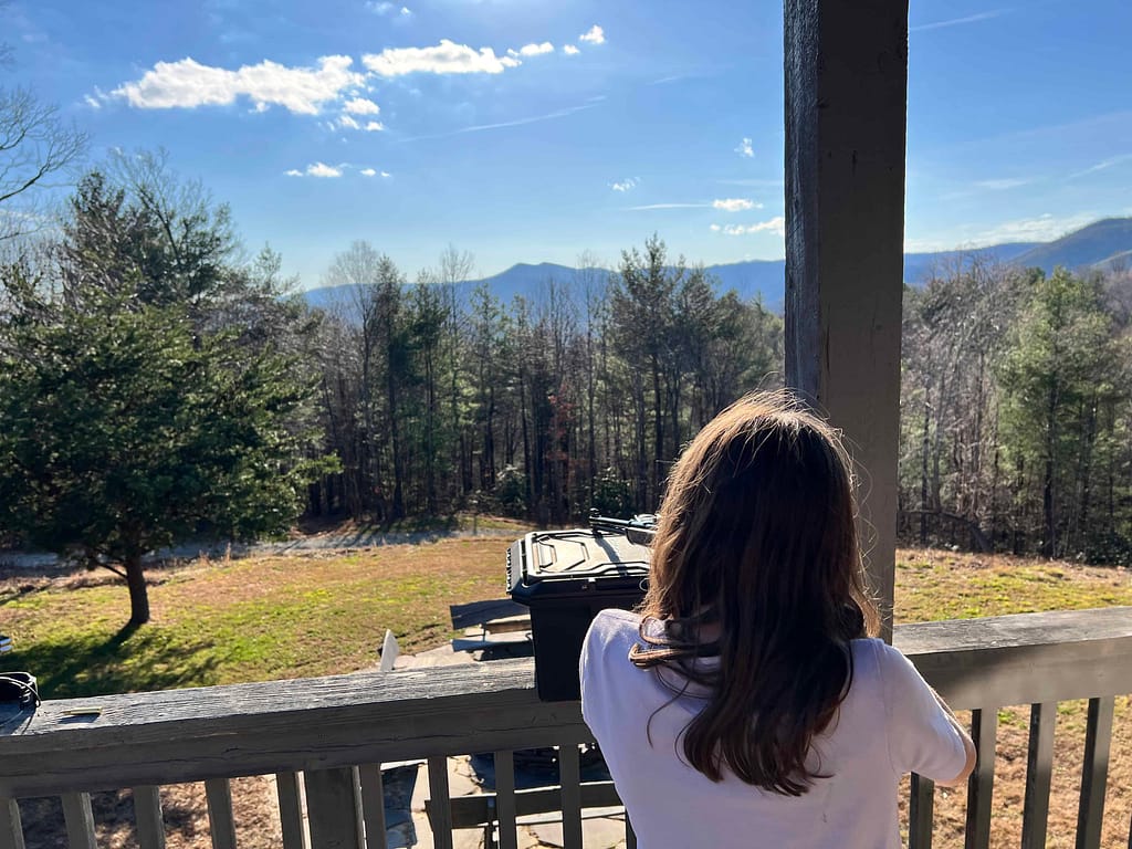 girl learning to shoot a gun