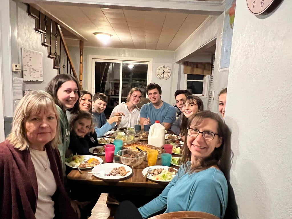 family eating dinner around the table