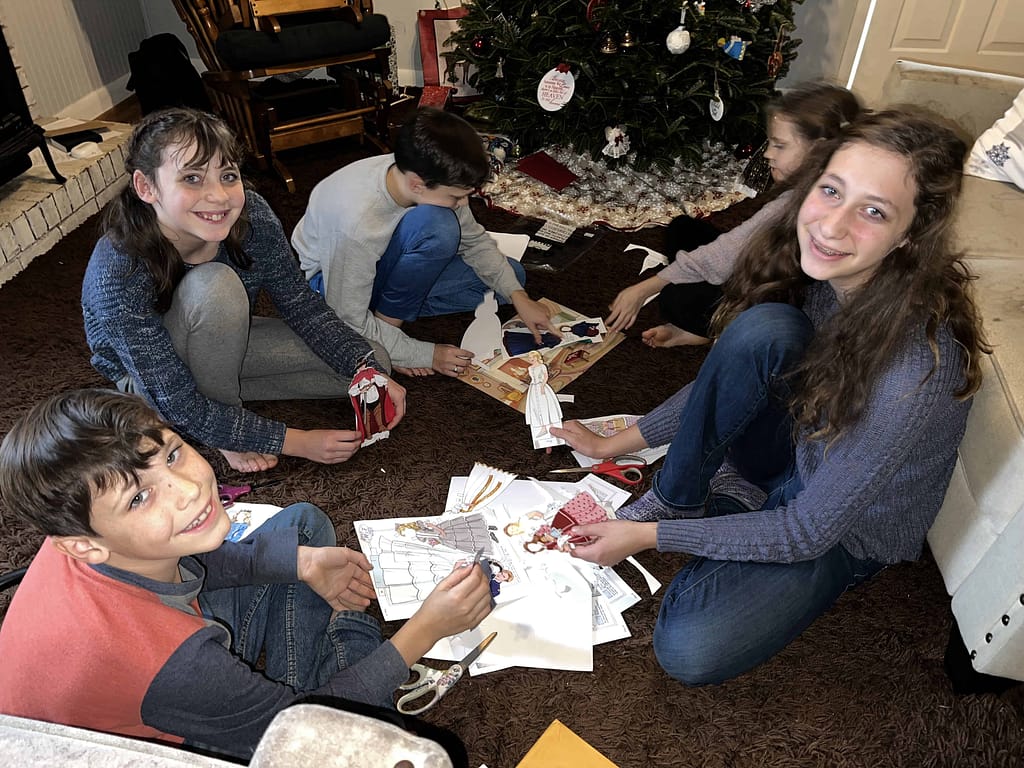 kids playing paper dolls