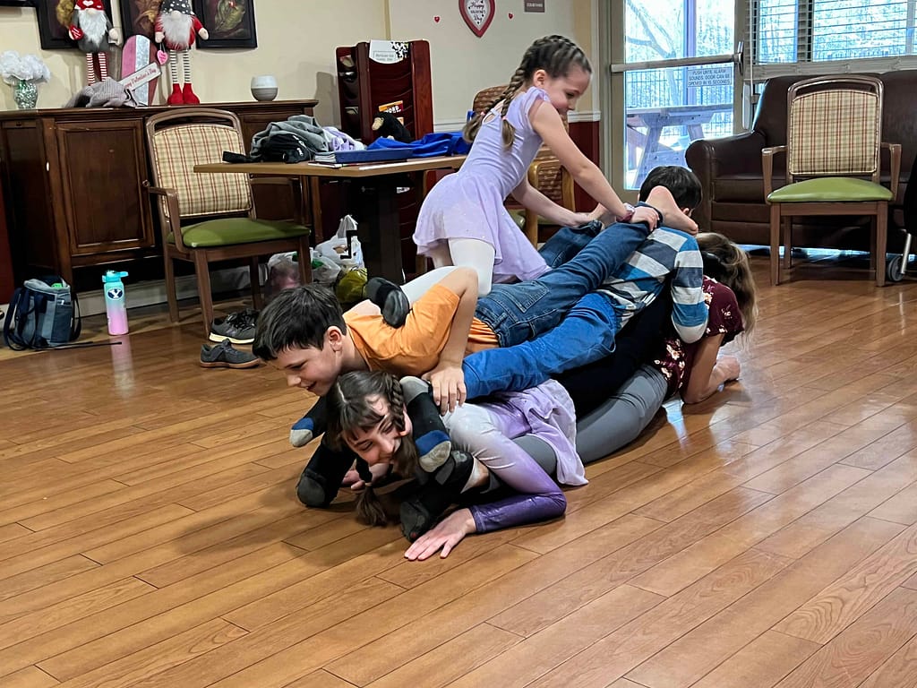 5 kids doing a pile up trick for a talent show