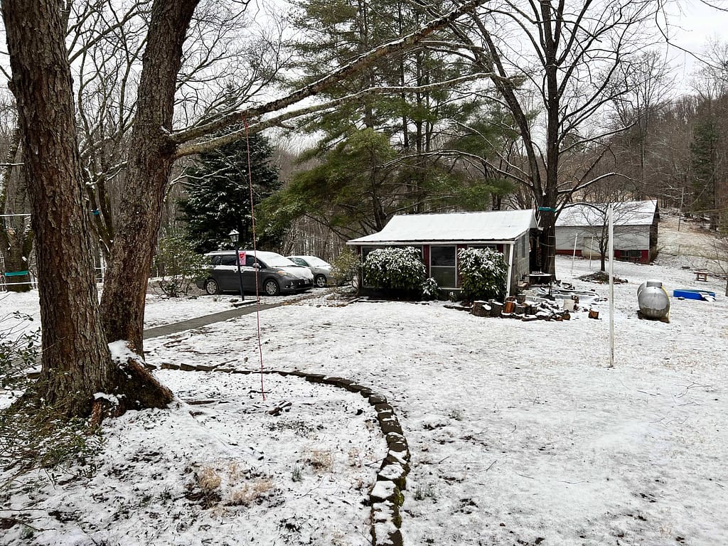 country yard with a dusting of snow