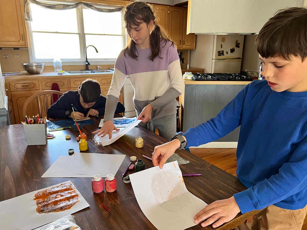 kids making a monolith painting