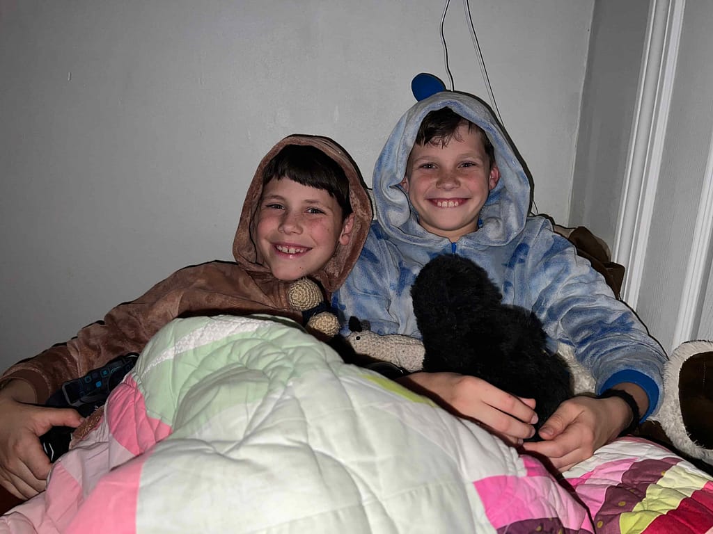 two brothers sleeping in a fort