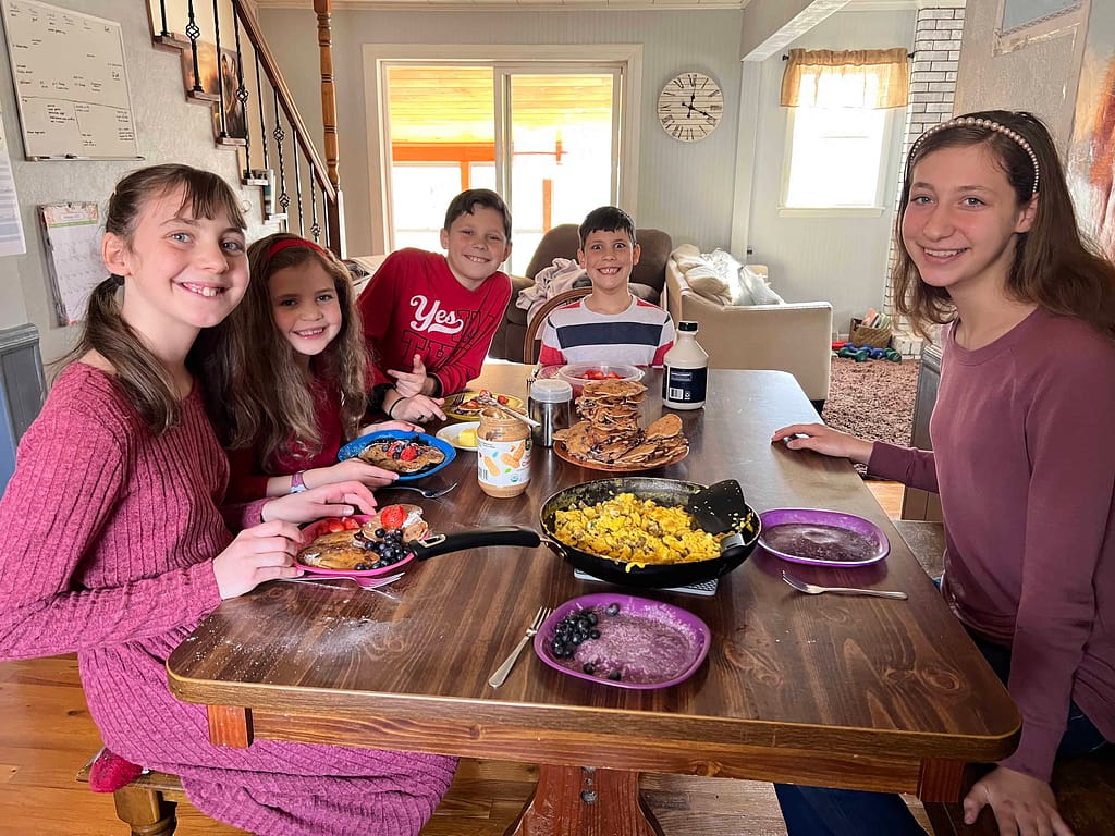 family eating pancakes for Valentine lunch
