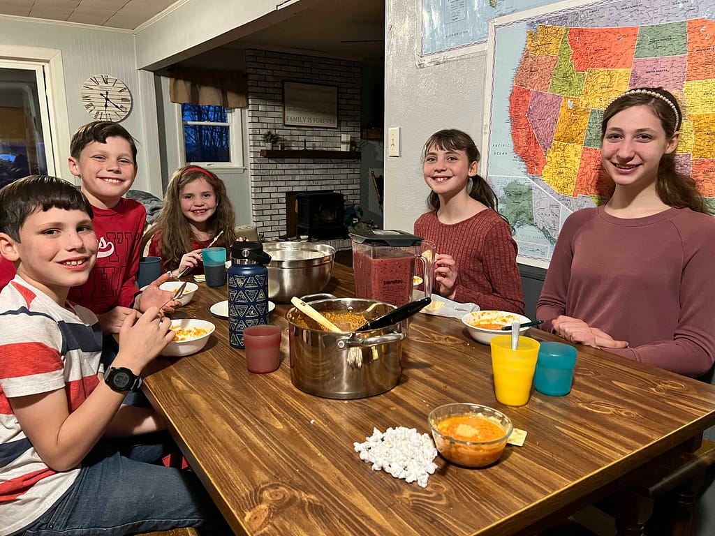 family eating tomato soup for Valentines Day