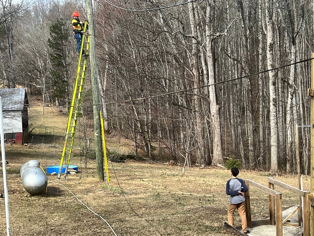 Spectrum guy putting internet at a rural house