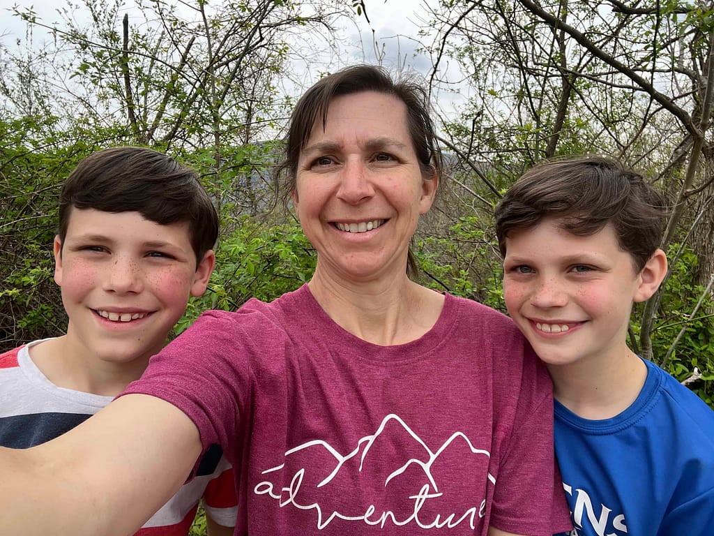 mom and sons hiking McAffee Knob in spring