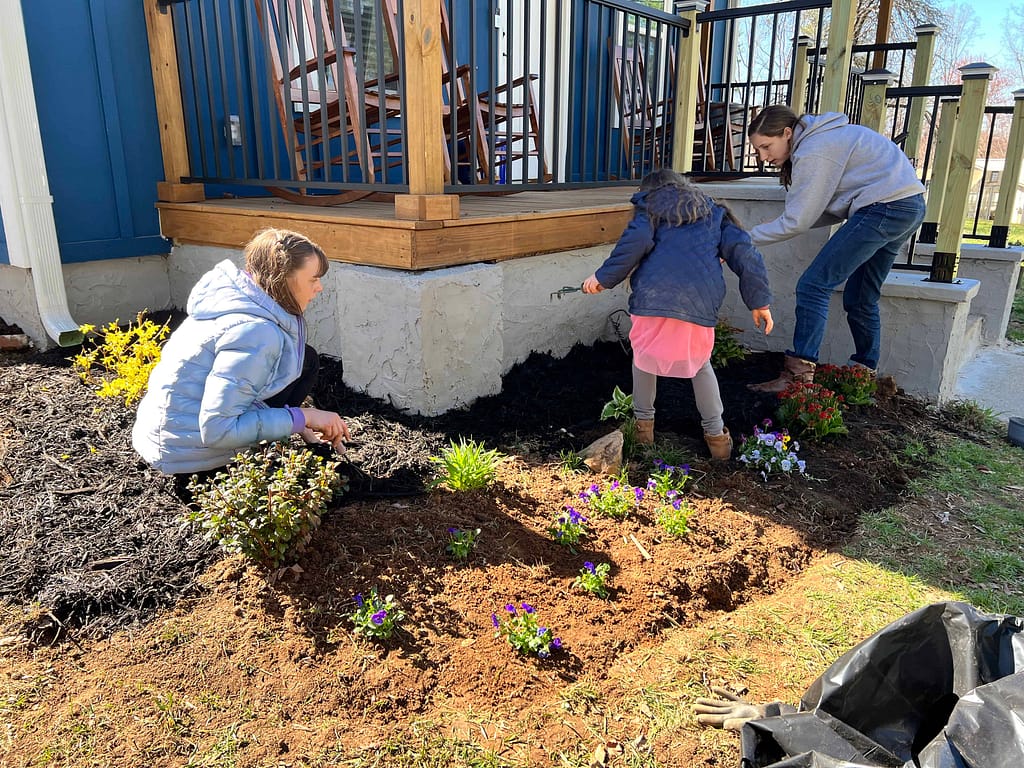 kids landscaping a yard