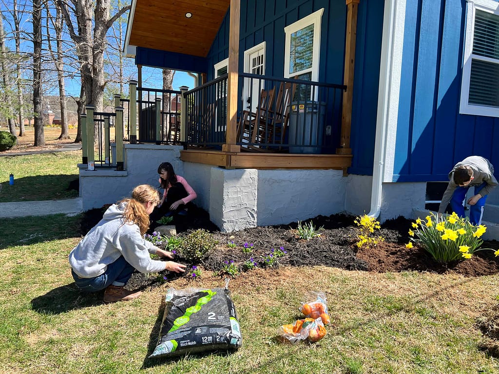 kids landscaping a yard