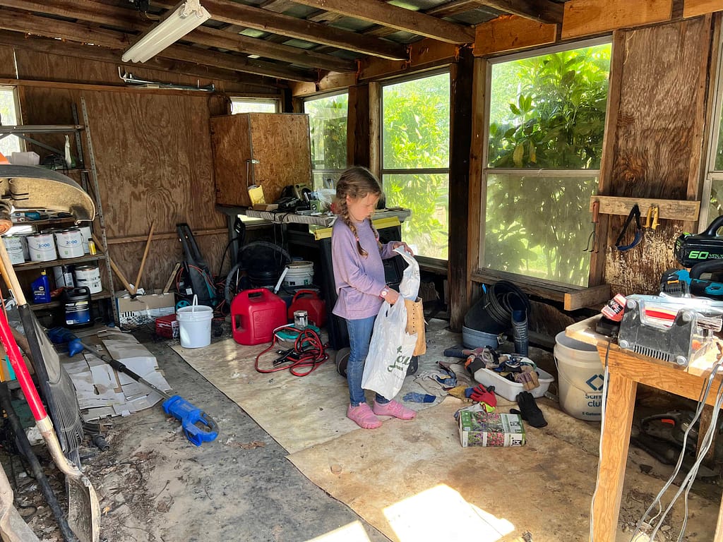 a messy wooden tool shed