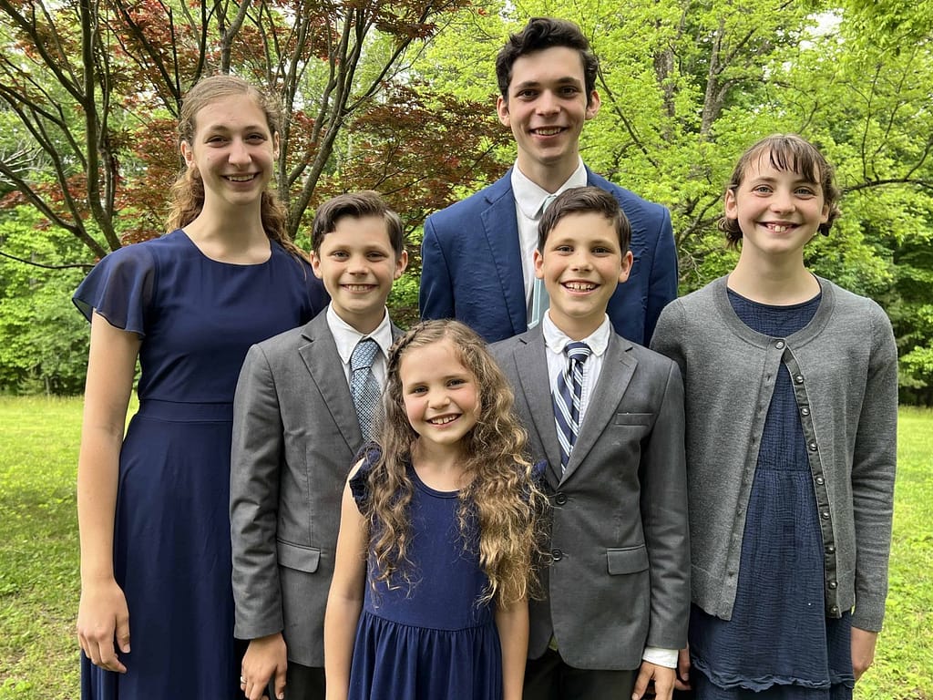 6 siblings wearing blue and gray