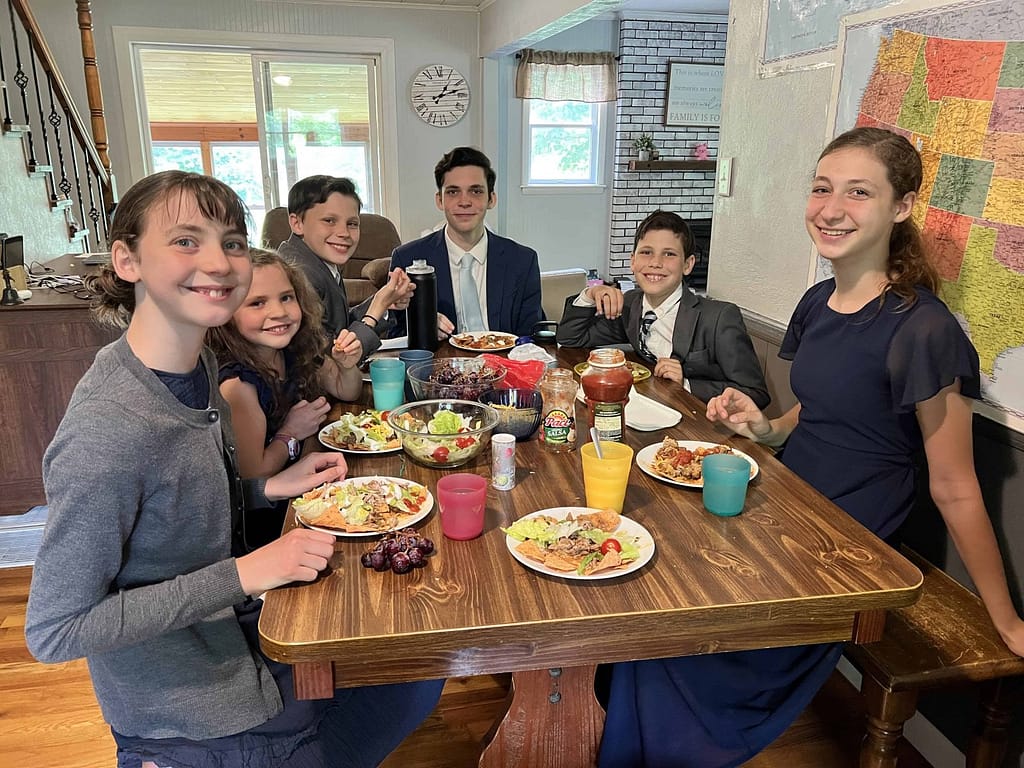 family eating dinner dressed up