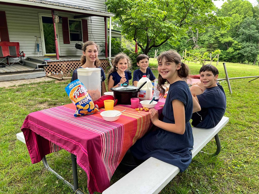 kids eating at a picnic table